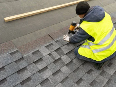 men working on asphalt single roof