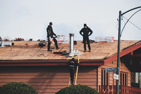 Men repairing roof